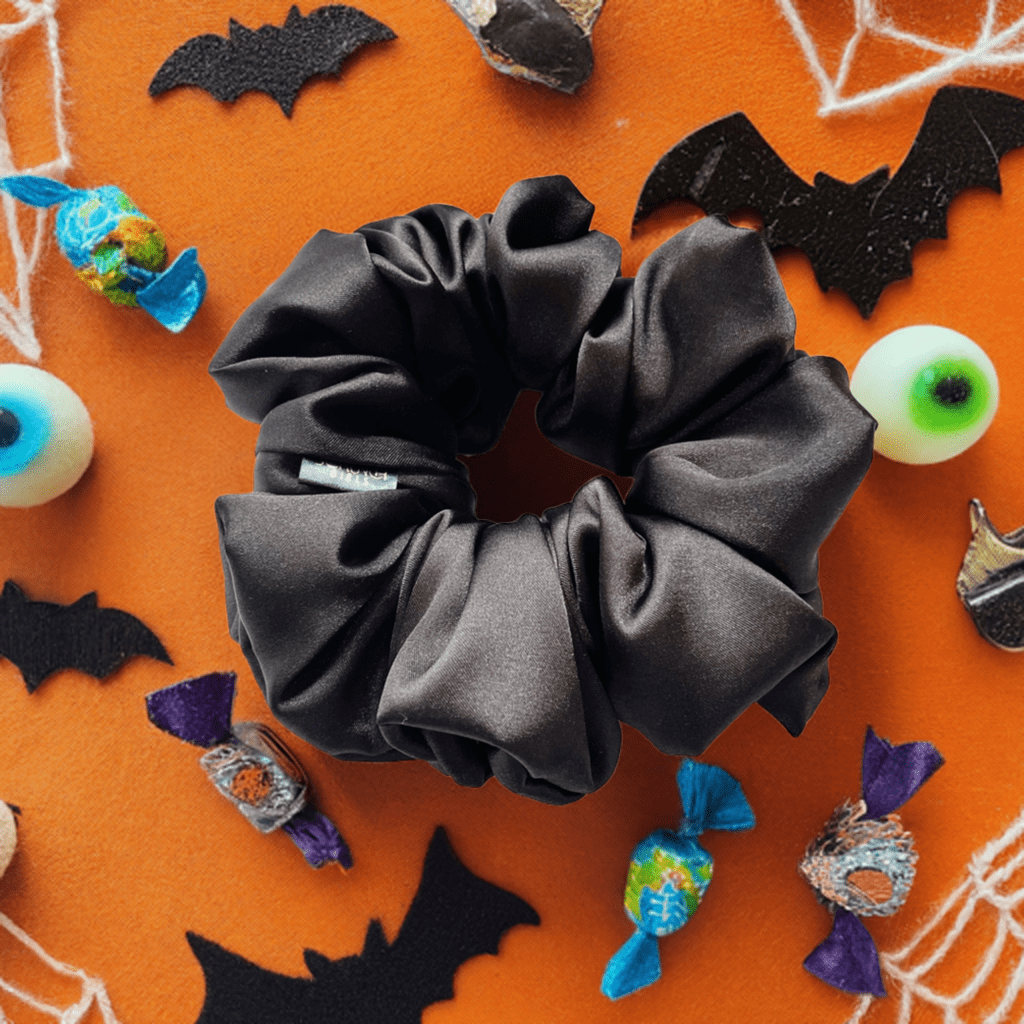 Addison. | a black satin scrunchie.