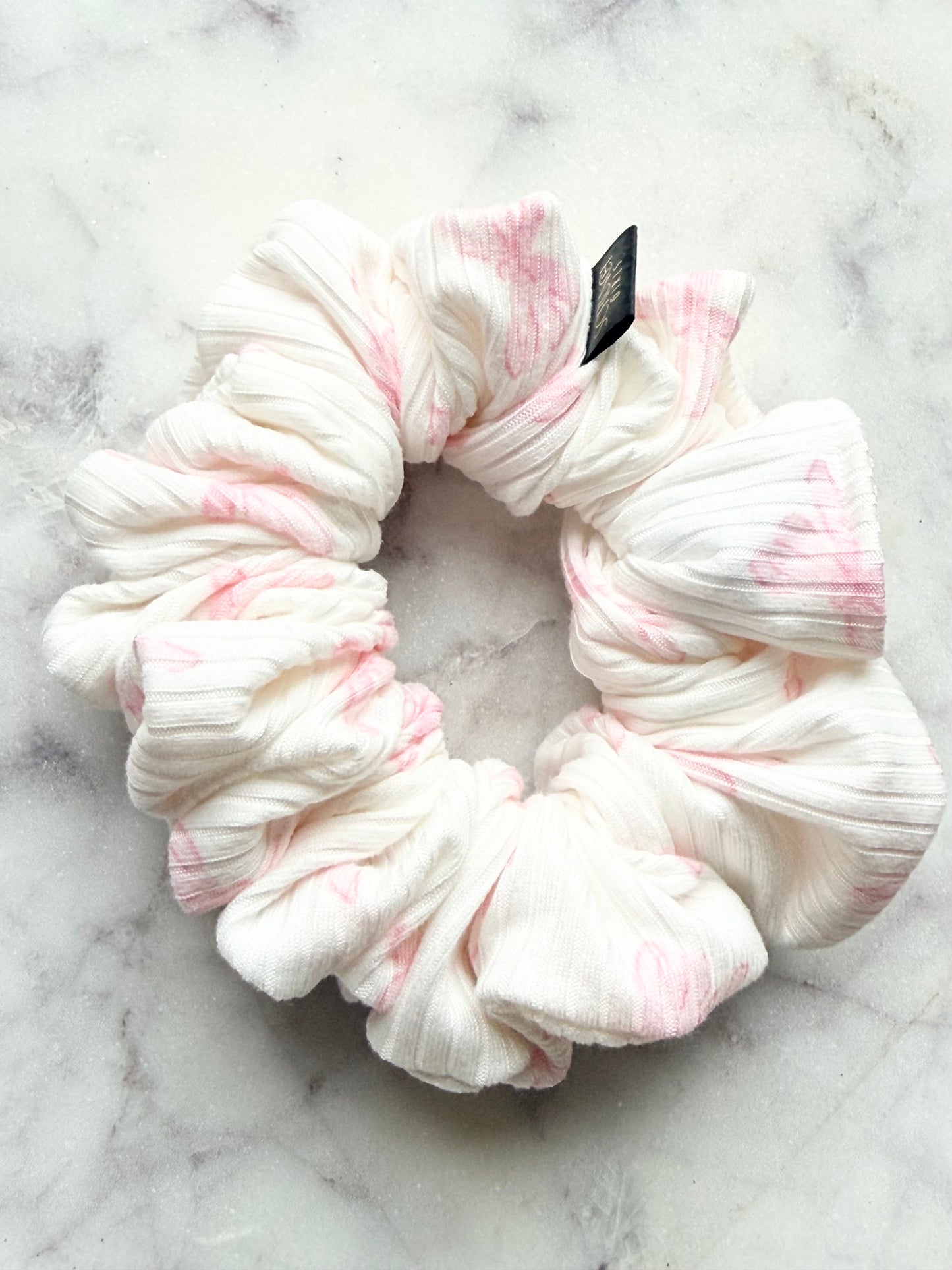 Paula.| a rib knit white jersey scrunchie with a pink bow print