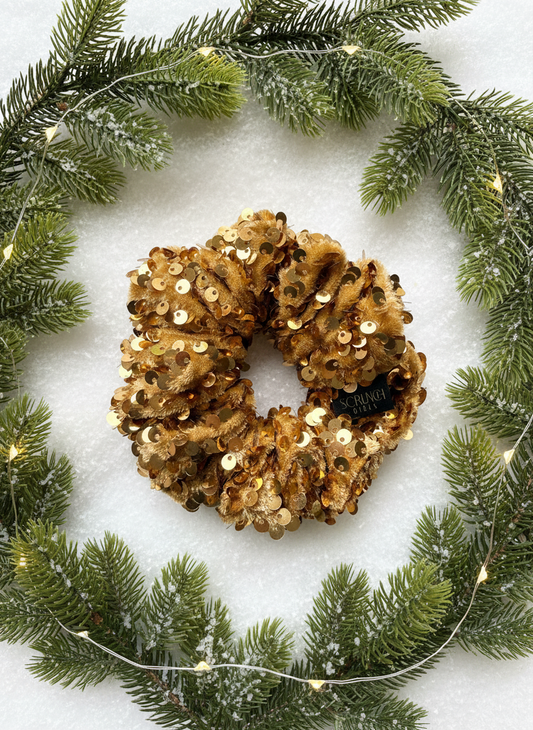 Jenaye. | A gold sequin Scrunchie.
