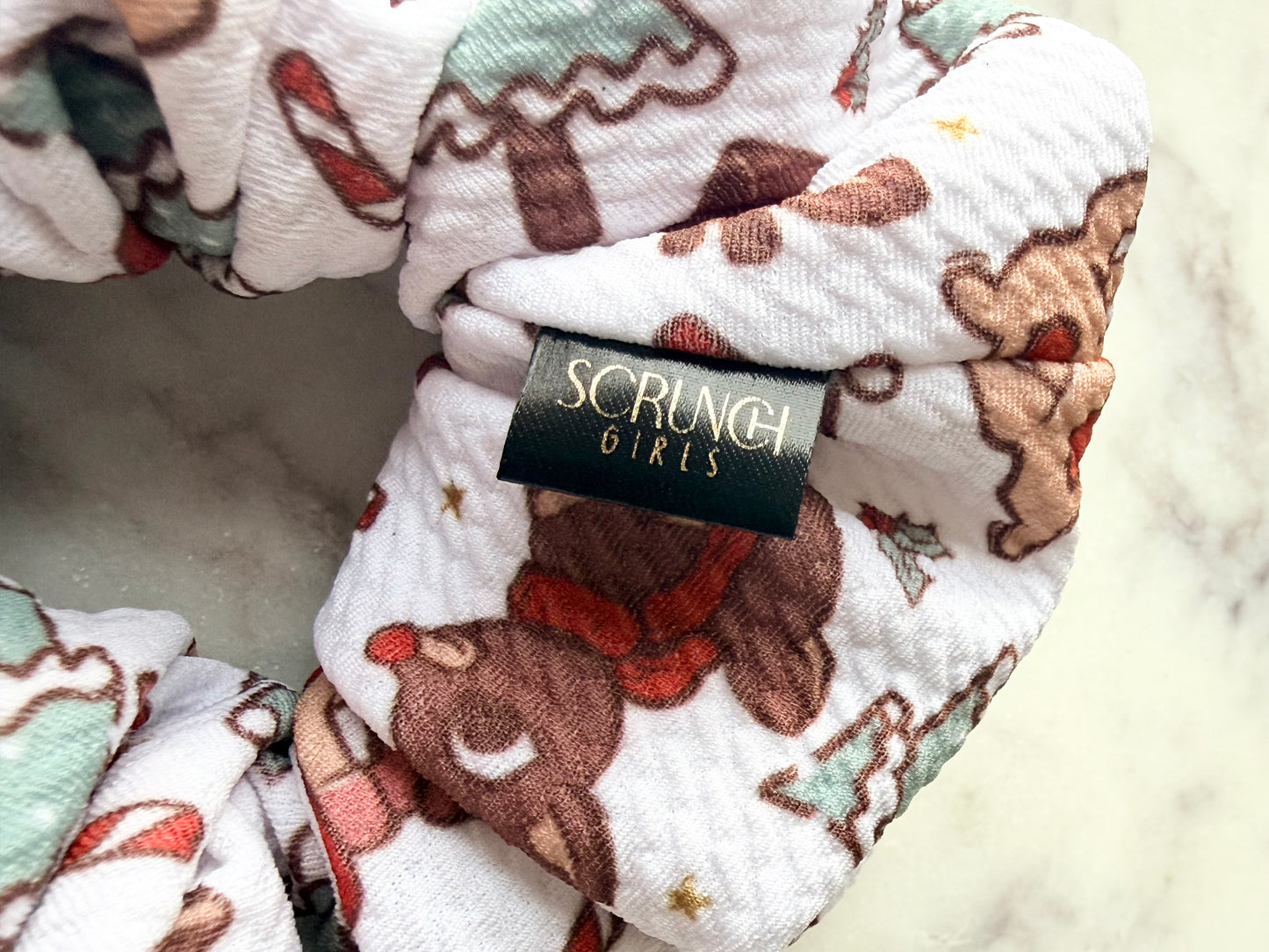 Rudolph | a white bullet fabric with a Rudolph print scrunchie