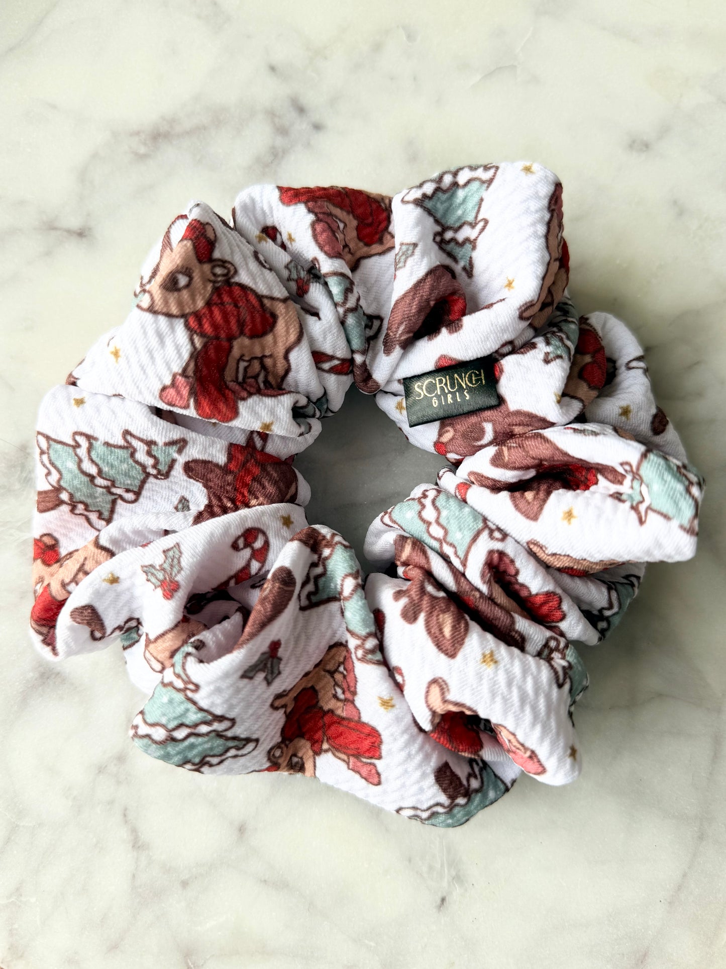 Rudolph | a white bullet fabric with a Rudolph print scrunchie