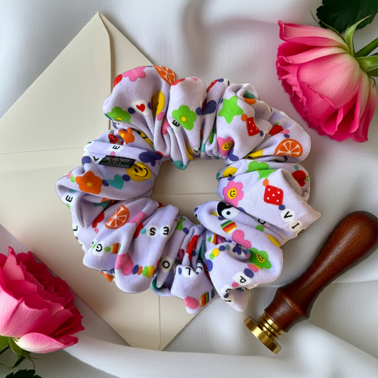 Taylor. | a friendship bracelet print Scrunchie
